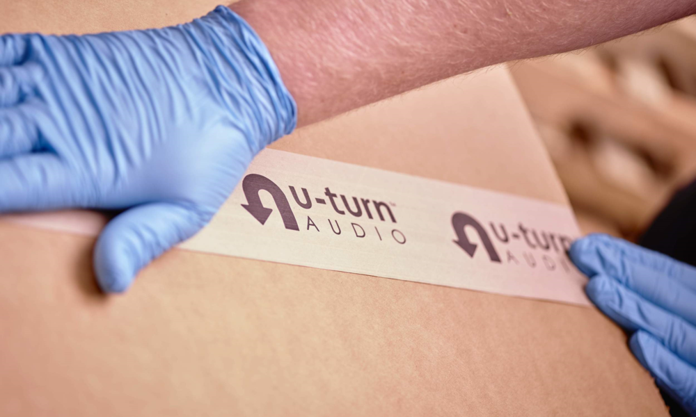 Packing tape being applied to a box for shipping