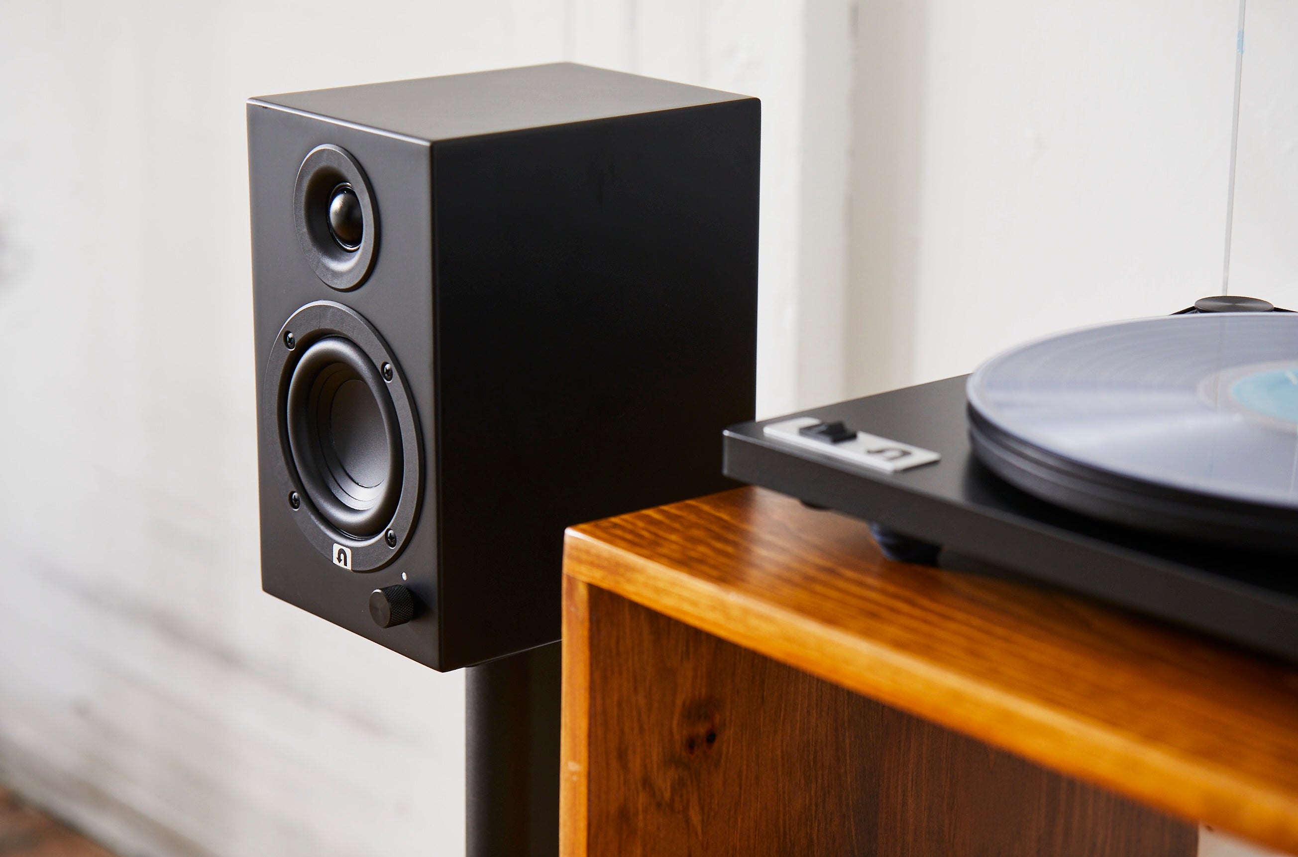 black speaker with black turntable